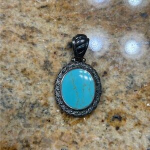 Turquoise Oval Pendant with Silver Detailing